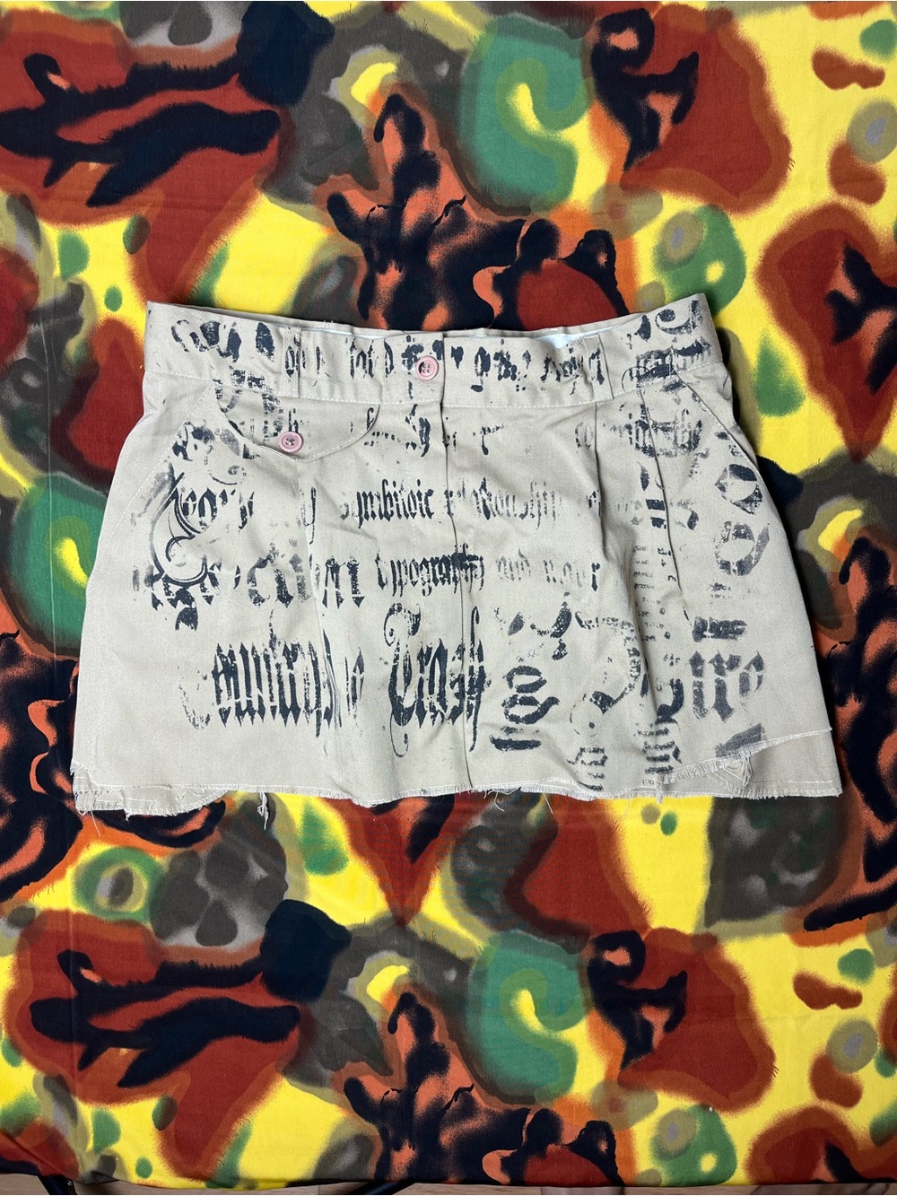 VTG Sag Harbor mini skirt with black graffiti-style text print